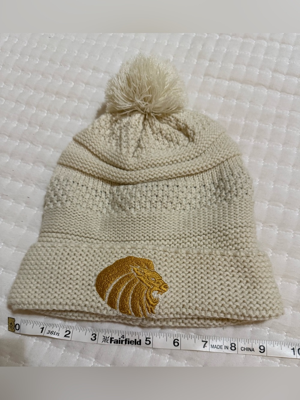 Cream Knit Pom Beanie with Gold Lion Patch